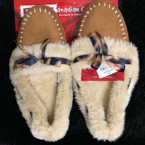 Super cozy moccasin slippers. New with tags!